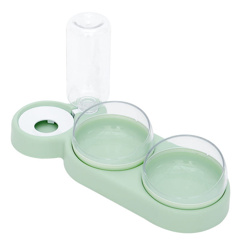Automatischer Tierfutter- und Wasserspender als Doppelschale in Mintgrün mit zwei klaren Glasschalen und einer transparenten Wasserflasche oben.