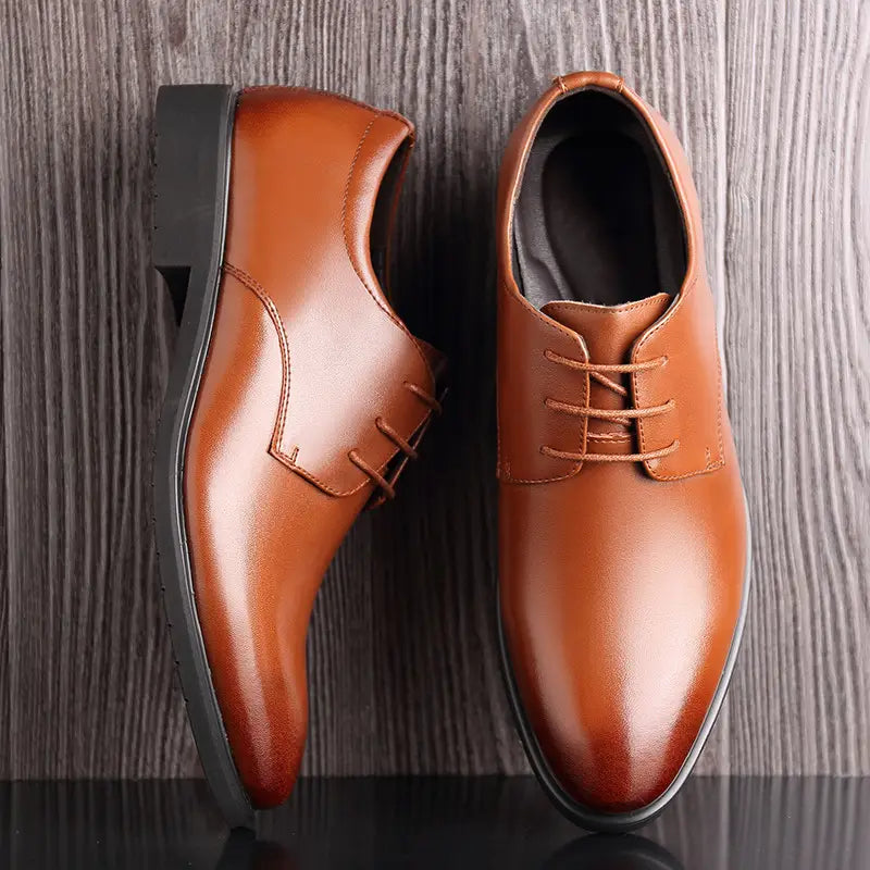 Men’s cowhide leather business oxford dress shoes in brown with a sleek polished finish and black rubber soles.