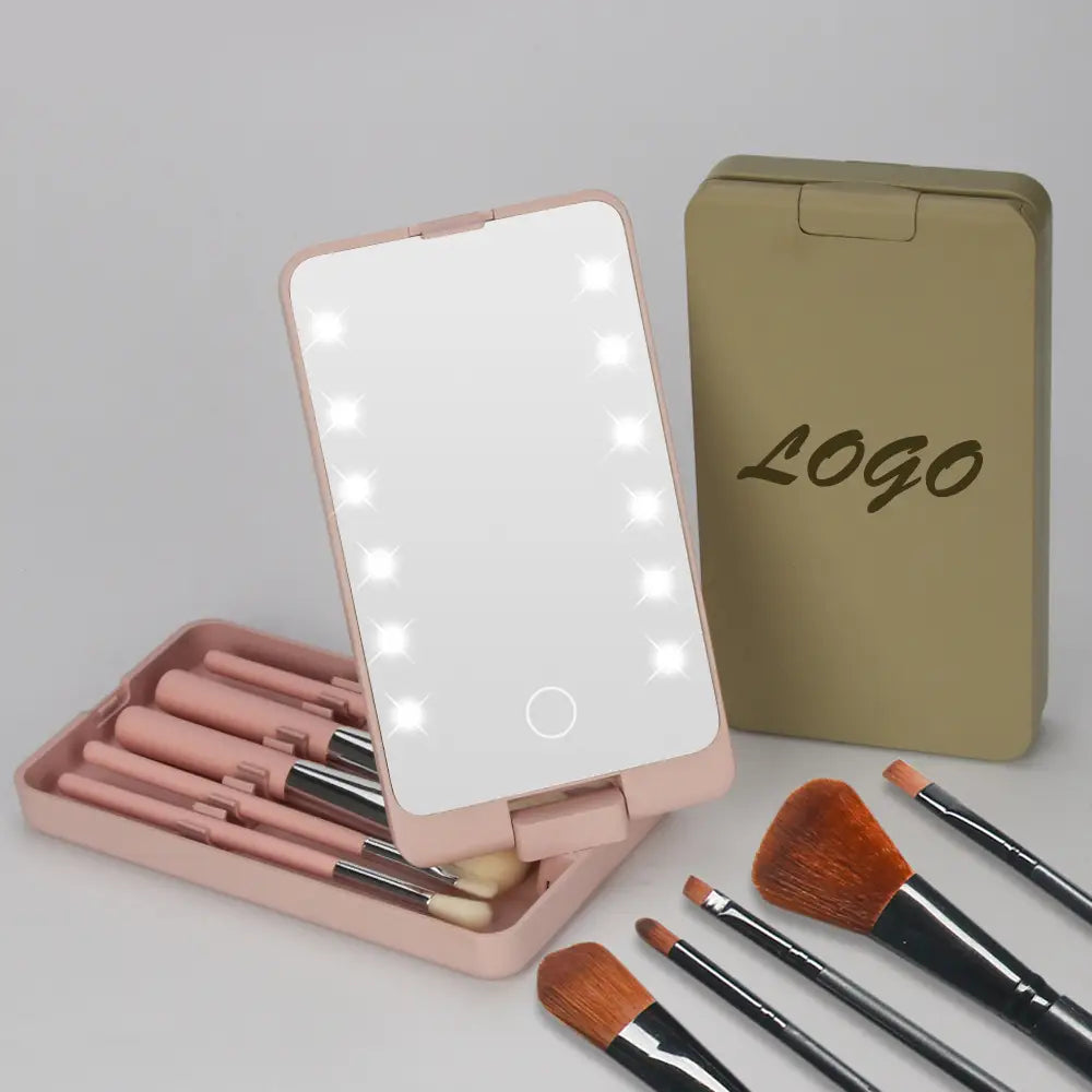 led makeup mirror with folding brush set case featuring pink illuminated edges with led lights and a compact case nearby.