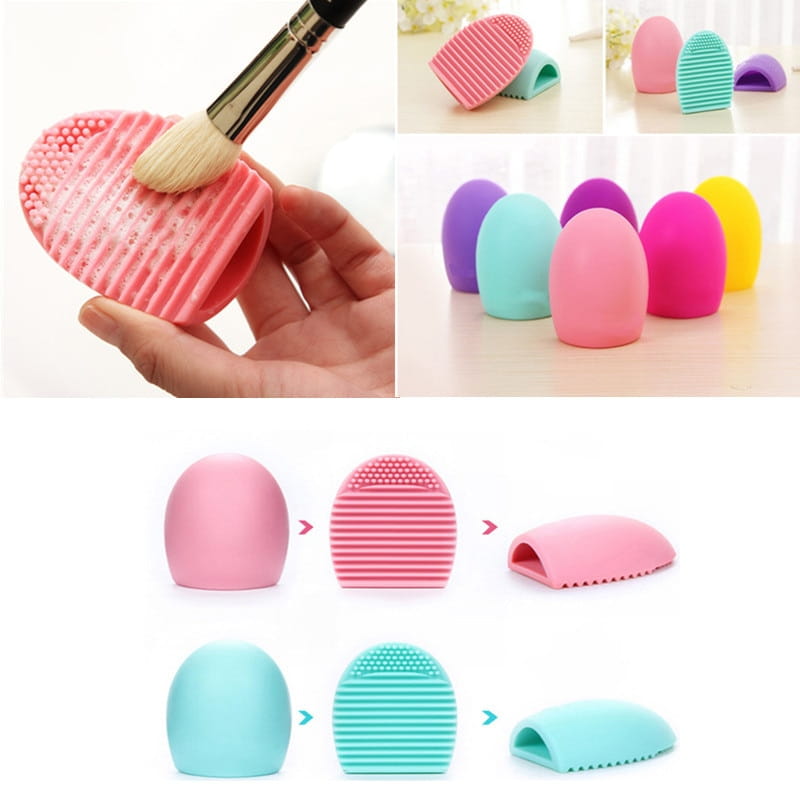 Pink silicone egg-shaped makeup brush cleaner with a textured ridged surface for effective bristle cleaning designed as a scrubbing tool.
