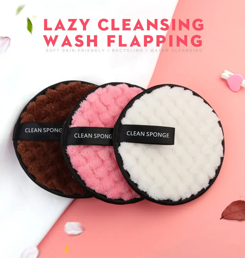 makeup removing puff 3 pack featuring three circular plush cleaning sponges in brown pink and white with black elastic bands labeled clean sponge and a mesh bag.