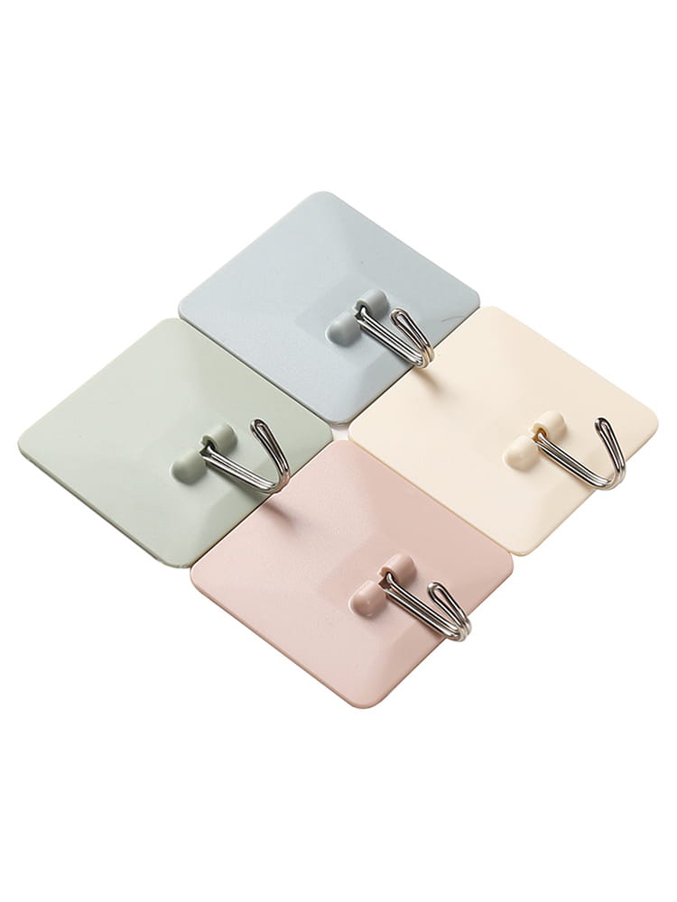 Ensemble de quatre crochets muraux adhésifs imperméables de couleurs pastel, avec des crochets en forme de J métalliques argentés, pour des solutions de suspension polyvalentes.