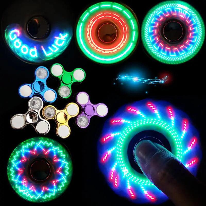 A hand holding an led fidget spinner glow in dark metallic hand toy with vibrant blue and pink glowing concentric patterns.