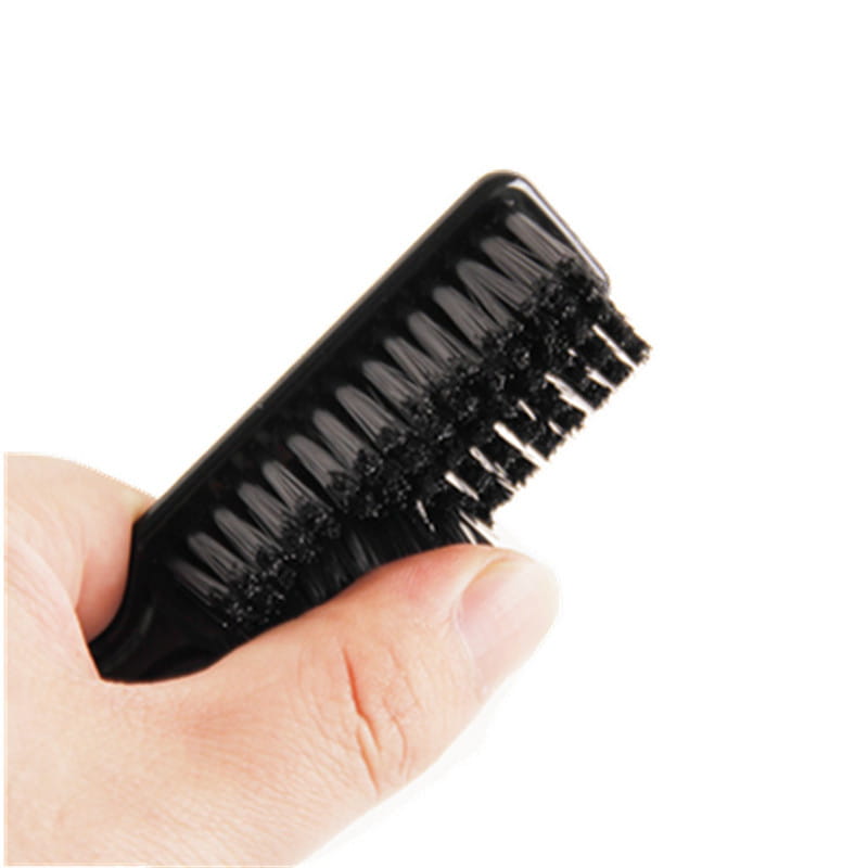 Black plastic beard brush with dense soft nylon bristles for barber grooming and cleaning.