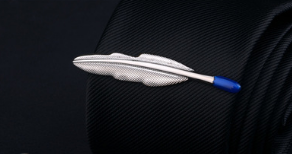 silver feather-shaped pin with blue-tipped stem made of metal for men’s airplane tie clip and lapel pin gift set as an elegant accessory