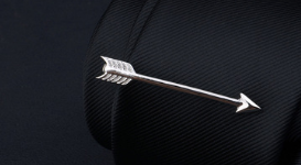 silver airplane tie clip and lapel pin gift set featuring an arrow-shaped pin with a sleek metallic finish and detailed fletching