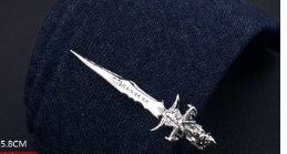 silver dagger-shaped lapel pin with intricate detailing and textured hilt from the men’s airplane tie clip and lapel pin gift set displayed on dark fabric