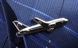 Silver airplane cufflink with a sleek polished finish and detailed wings and fuselage design from the men’s airplane tie clip and lapel pin gift set.
