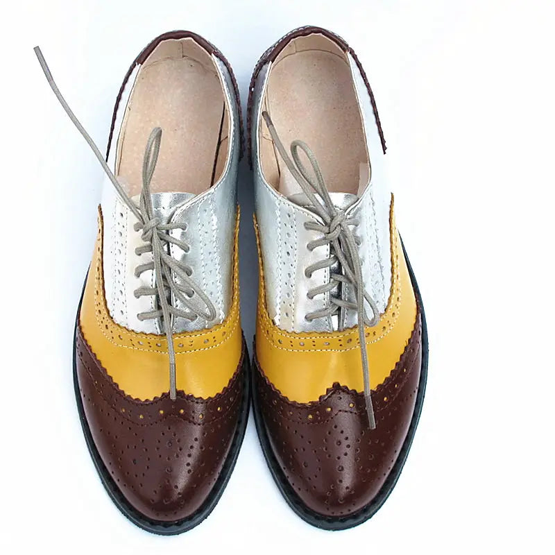 Leather oxford brogue shoes for women in brown yellow and silver two-tone leather with perforated detailing.
