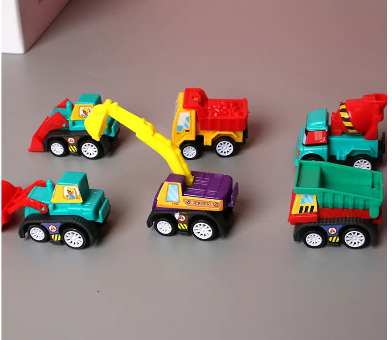 A colorful plastic pull back fire truck and engineering vehicle toy set featuring a yellow excavator, red dump truck, teal cement mixer, and green dump truck with black wheels.