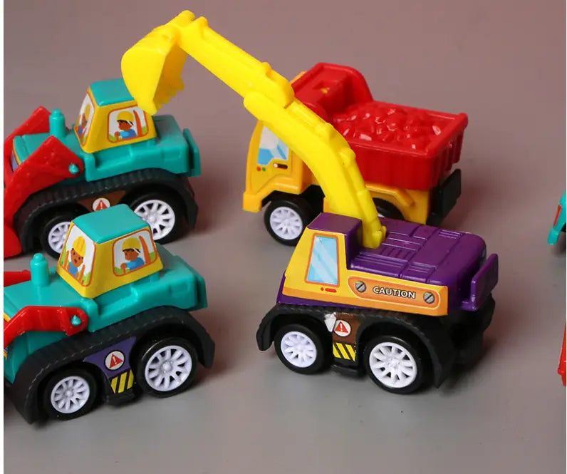Yellow plastic excavator toy with a pull back feature is shown in front of a red dump truck in the pull back fire truck and engineering vehicle toy set.