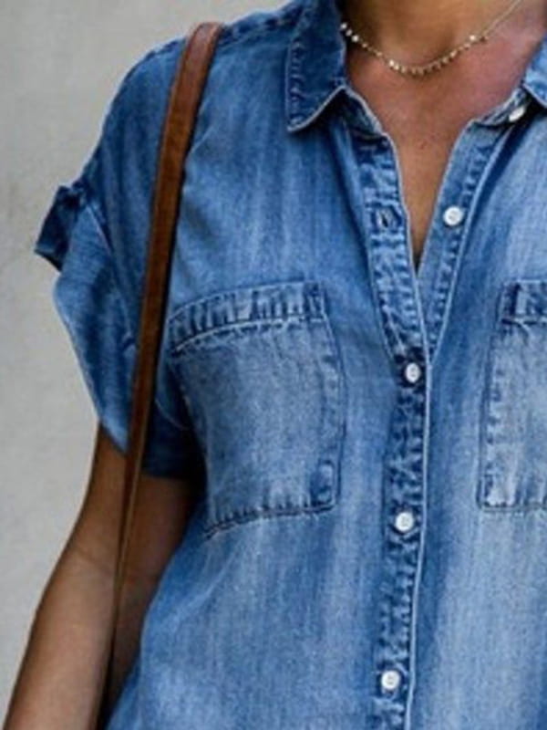 Slim fit short sleeve button front denim midi dress in blue denim with rolled-up sleeves and two front pockets.