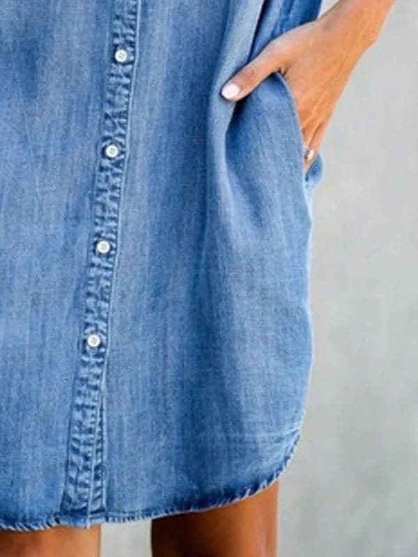 Slim fit short sleeve button front denim midi dress in blue with a casual relaxed fit and visible stitching details.