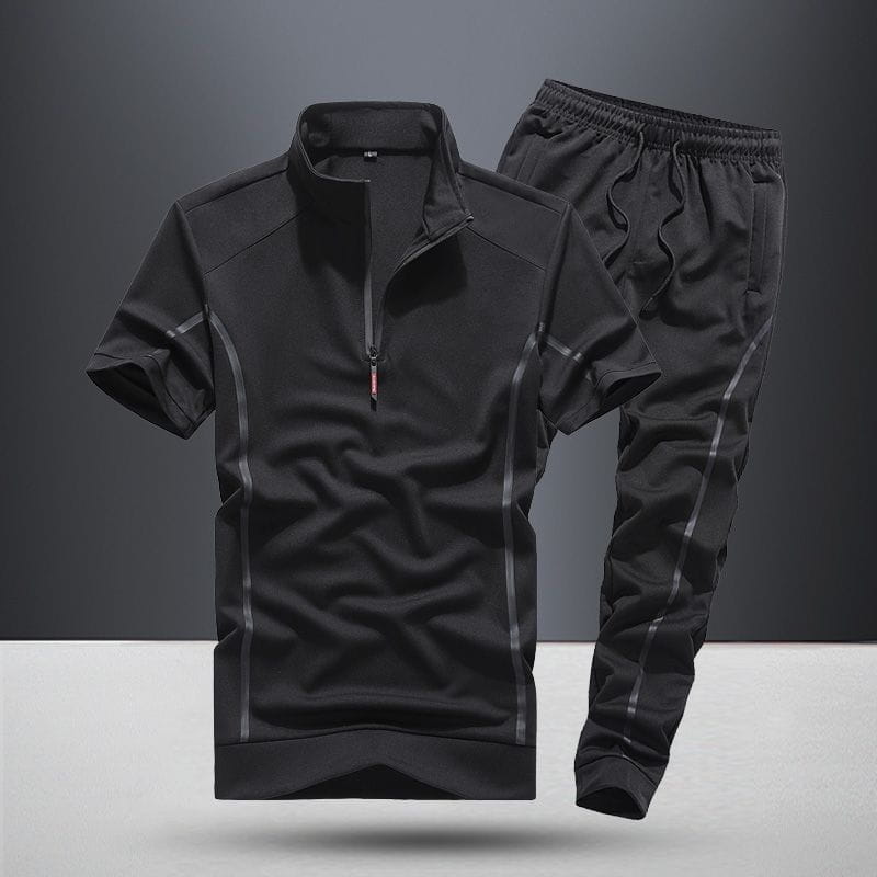Men summer athletic short sleeve two piece set in black with subtle gray piping along the sides and seams designed for active wear.