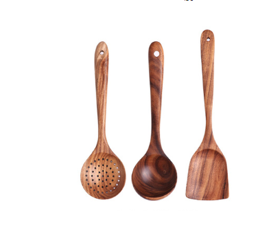 Set of three teak wood kitchen utensils with natural wood grain including a slotted spoon solid ladle and flat spatula for cooking.