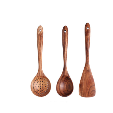 Set of three teak wood kitchen utensils with natural wood grain including a slotted spoon rounded ladle and flat spatula for cooking.