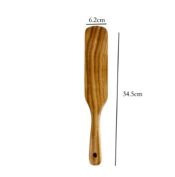 A wooden spatula from the teak wood kitchen utensil set cooking spoons 7pcs with a smooth light brown finish and natural wood grain pattern.