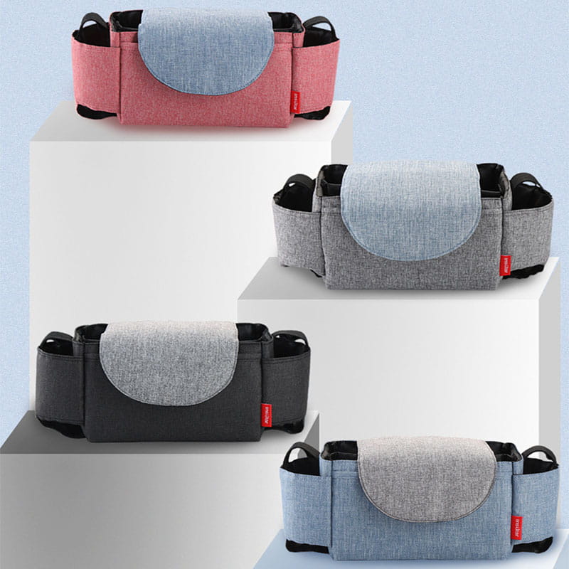 stroller organizer bag with multi storage pockets in pink gray and black fabric featuring a contrasting light blue circular flap.