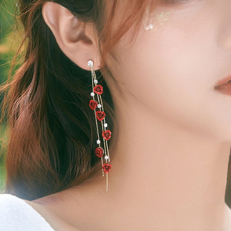 Elegant rose tassel drop earrings featuring red rose pendant with silver chains and clear crystal accents.