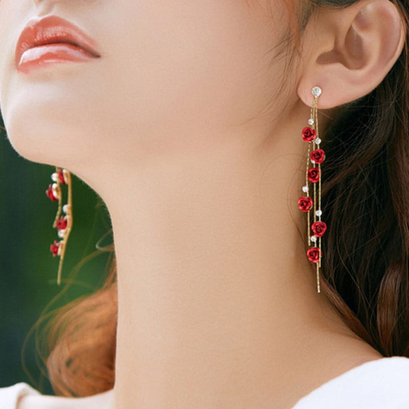 Elegant gold-toned drop earrings featuring cascading red rose charms and delicate white pearl accents with rhinestones and pearls.