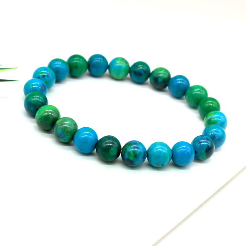 Handmade phoenix stone beaded energy bracelet featuring vibrant turquoise and green howlite beads with a smooth polished finish.