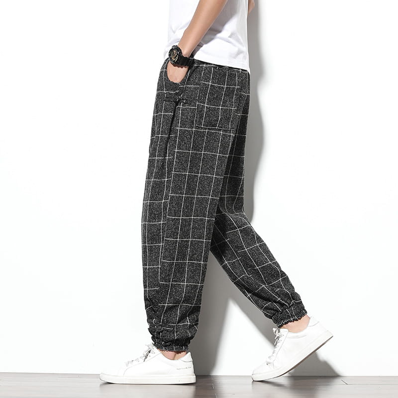 men plaid harem pants featuring black and white checkered cotton fabric with elastic cuffs designed as loose casual cropped trousers