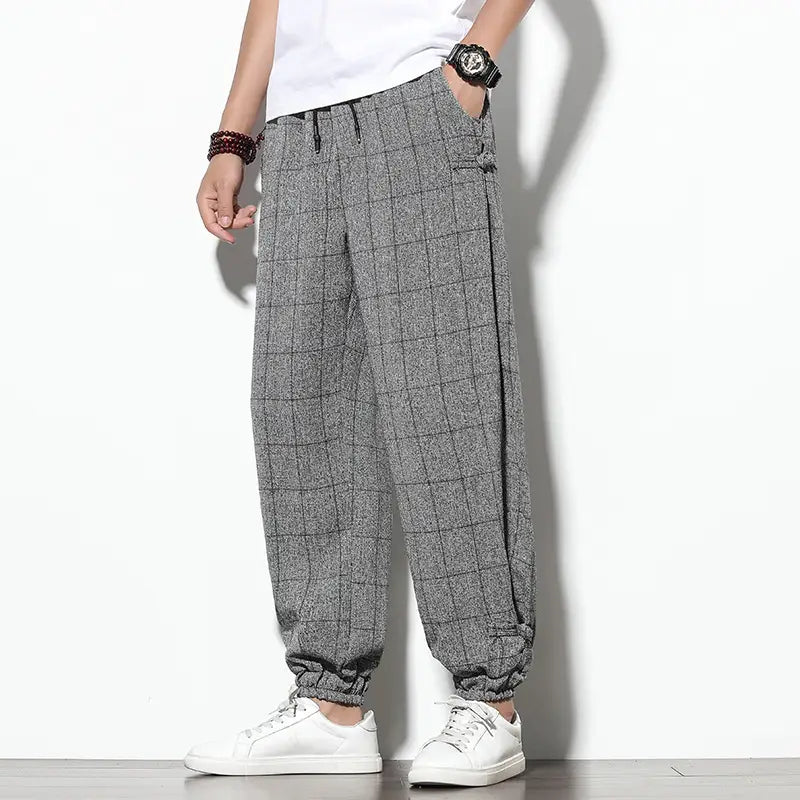 Men plaid harem pants loose casual cropped trousers in gray with a relaxed fit and elastic cuffs.