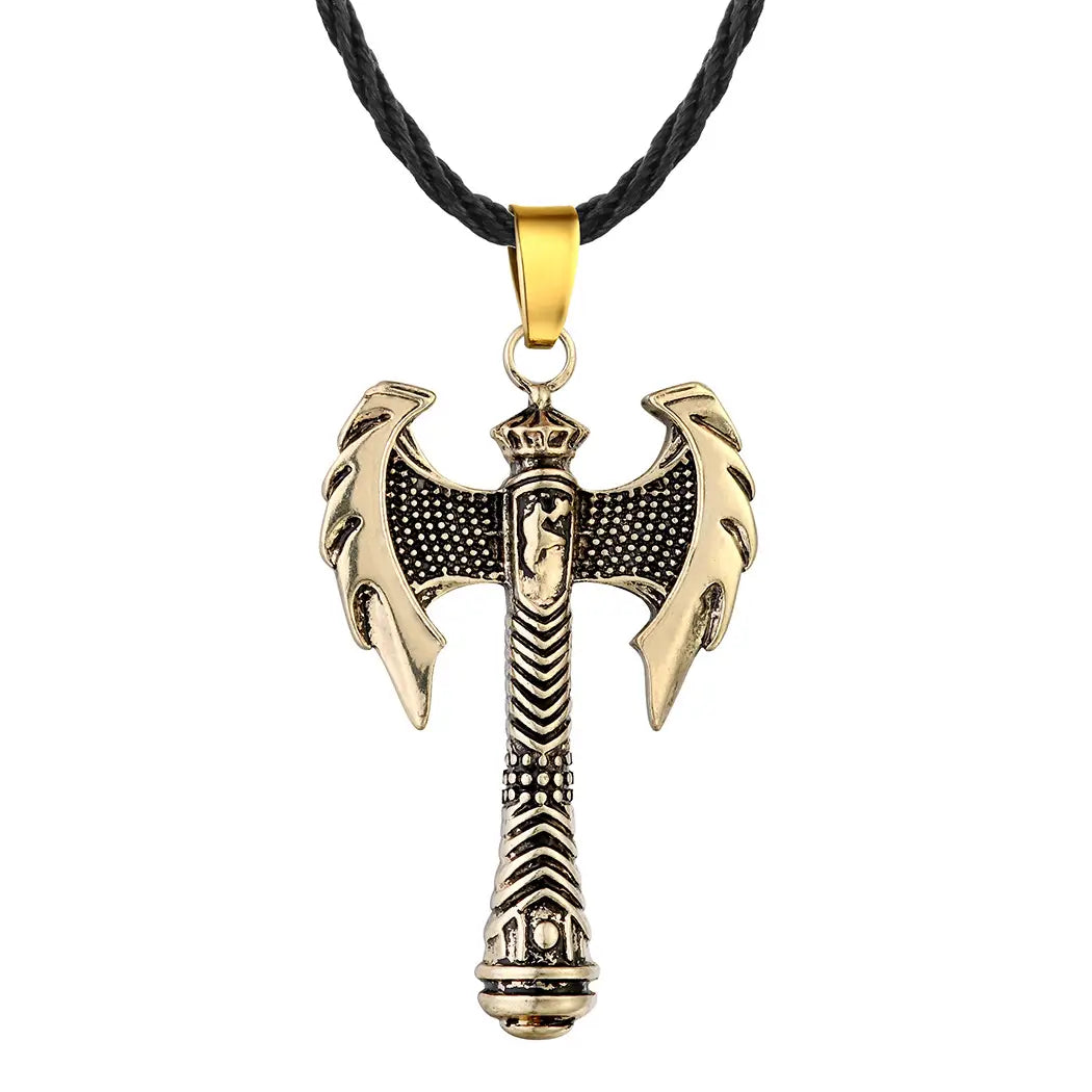 Intricate viking axe pendant necklace featuring a gold-toned double-headed axe with black and gold detailing hanging from a black braided cord.