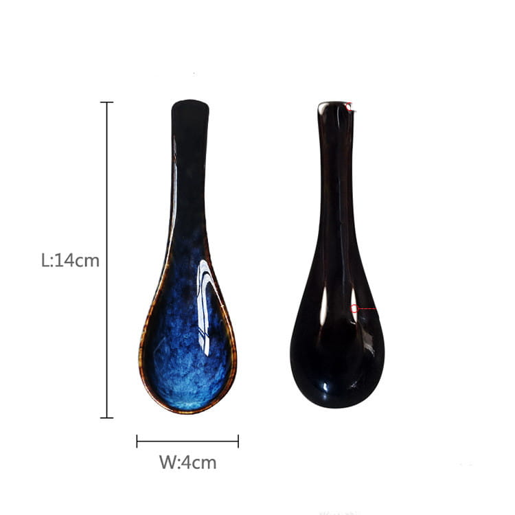 A sleek glossy black ceramic spoon with a vibrant blue speckled kiln glaze porcelain interior and a gold-toned rim for tableware use.