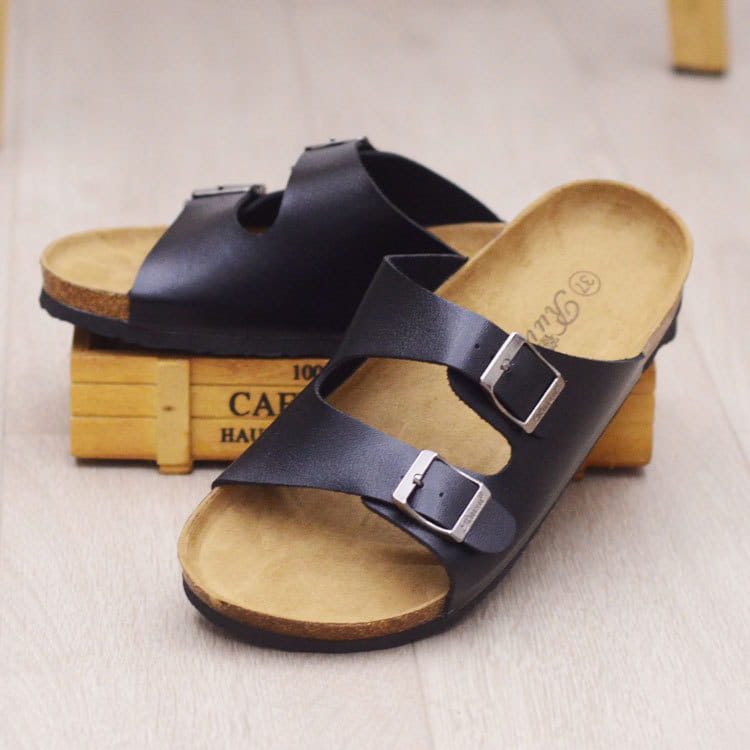 black leather two strap sandals with silver buckles and a cork footbed for comfortable casual wear