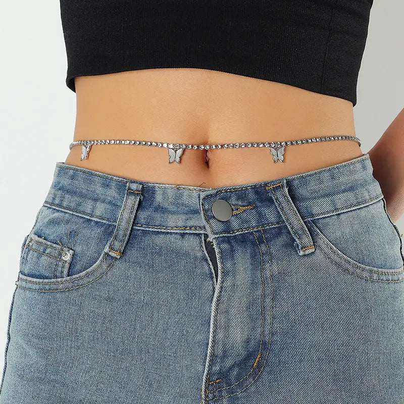 Silver butterfly-themed belly chain with sparkling rhinestone accents and delicate metalwork designed as a waist chain.