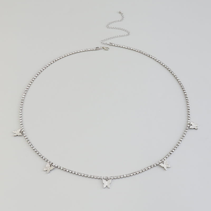 Silver choker necklace adorned with delicate butterfly charms and a beaded chain featuring sparkling rhinestone accents.