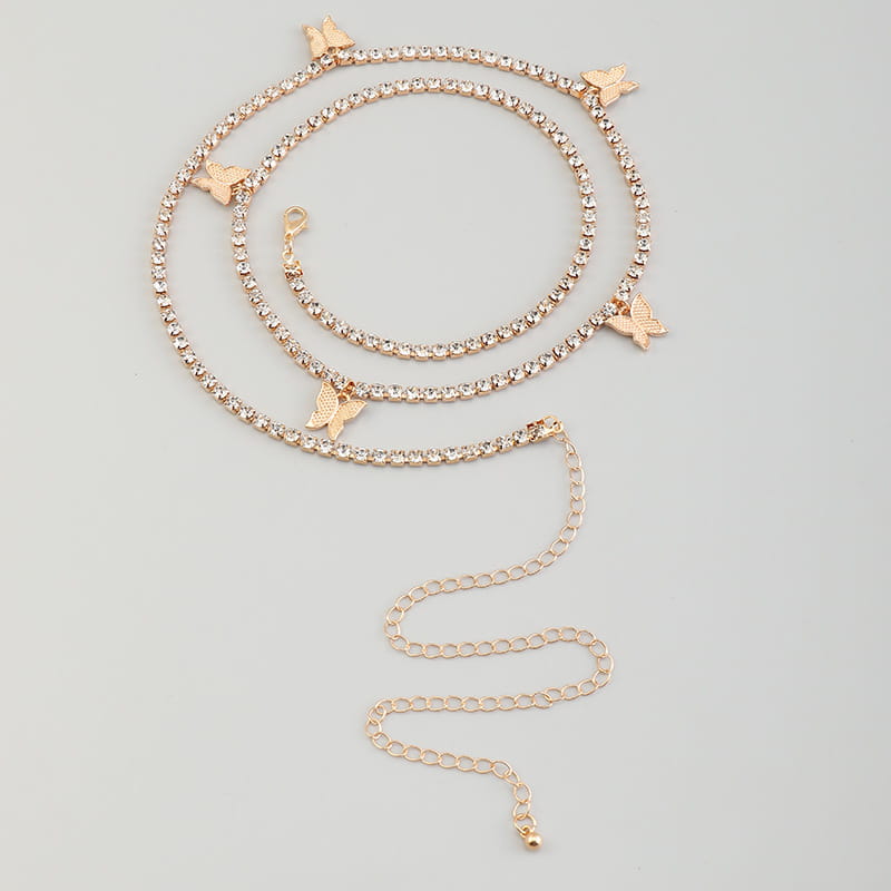 Gold-toned ankle bracelet featuring sparkling rhinestones and delicate butterfly charms for elegant waist adornment.