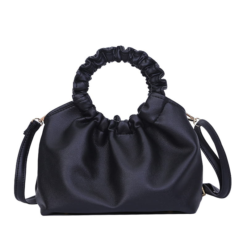 Black leather ruched leather bucket bag with a ruched top handle and adjustable shoulder strap.