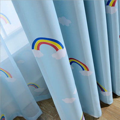 Light blue sheer curtains for kids room featuring colorful rainbow and cloud patterns in a lightweight fabric.