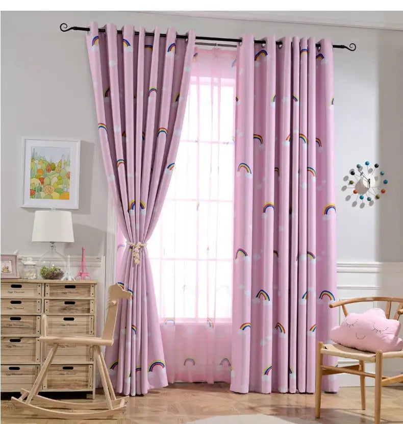 pink curtains with rainbow and cloud patterns feature grommet tops on a black rod as part of rainbow blackout and sheer curtains for kids room.