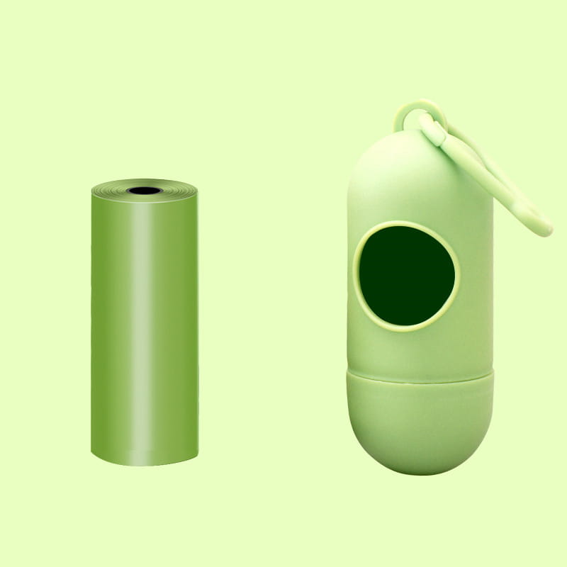 Mint green silicone dog poop bag dispenser with matching roll of plastic waste bags designed for convenient pet waste disposal.