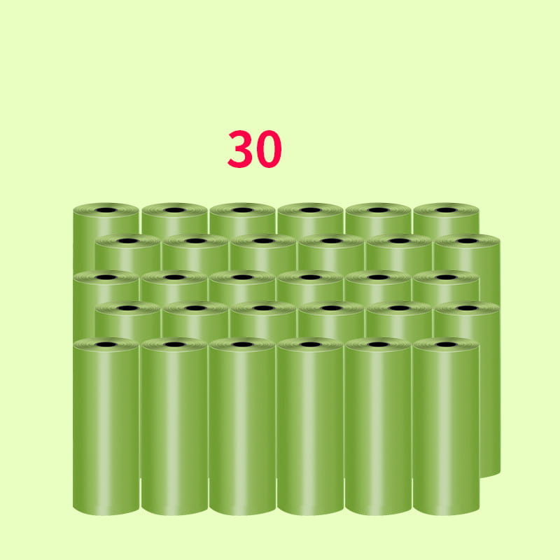 Thirty rolls of translucent green plastic dog poop waste bags included in a dispenser and waste bags set.