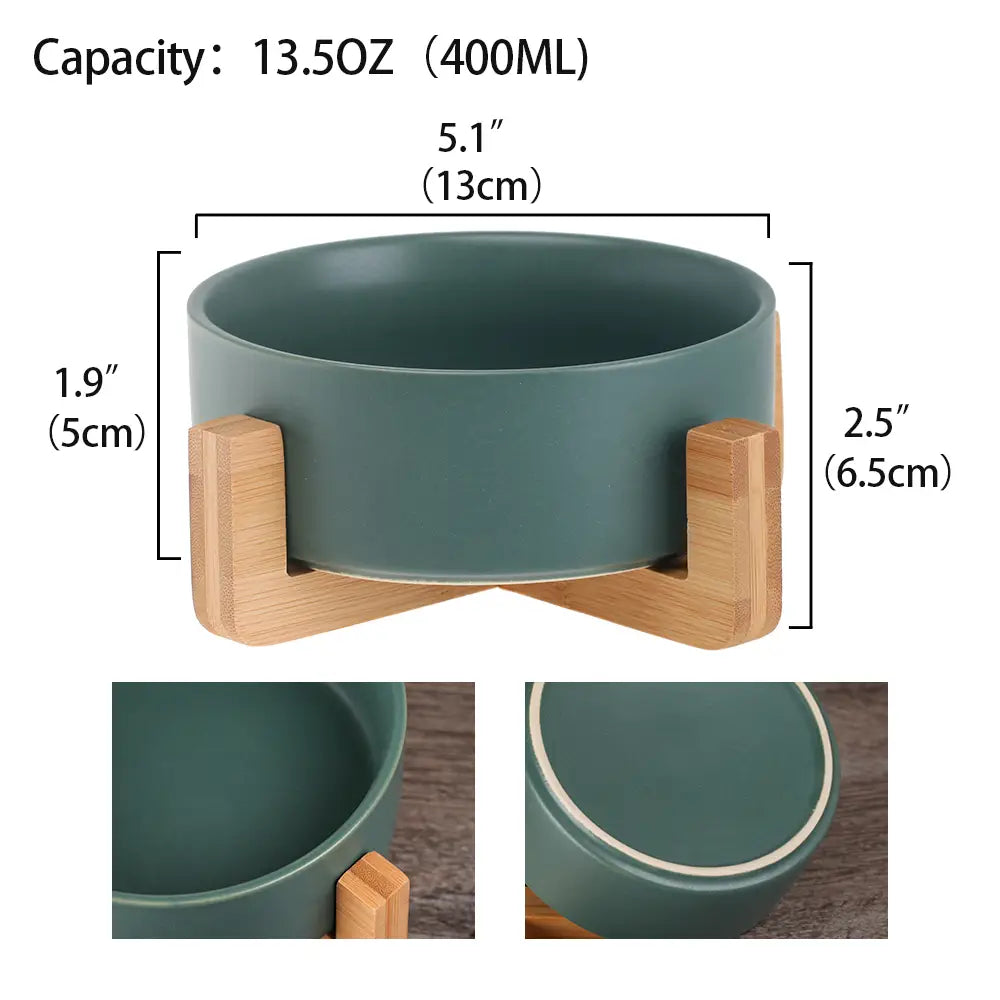 a ceramic double pet bowl with a wood stand featuring a matte teal ceramic bowl with a 13.5oz capacity and smooth rounded edges