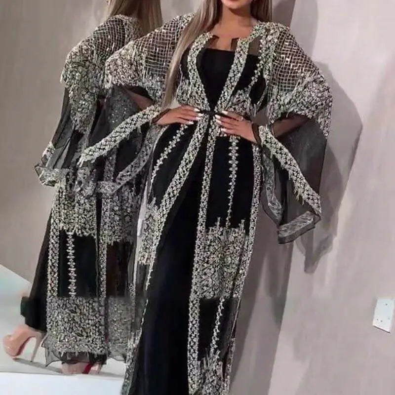 Black and silver embellished sheer overlay abaya with intricate beaded detailing along the front panels sleeves and hem, designed as an embellished lace V neck Chinese retro evening gown.