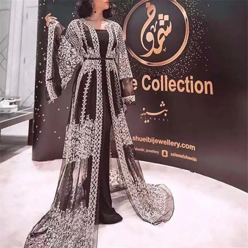 Elegant black and silver embroidered sheer overlay embellished lace v neck Chinese retro evening gown with long flowing sleeves.