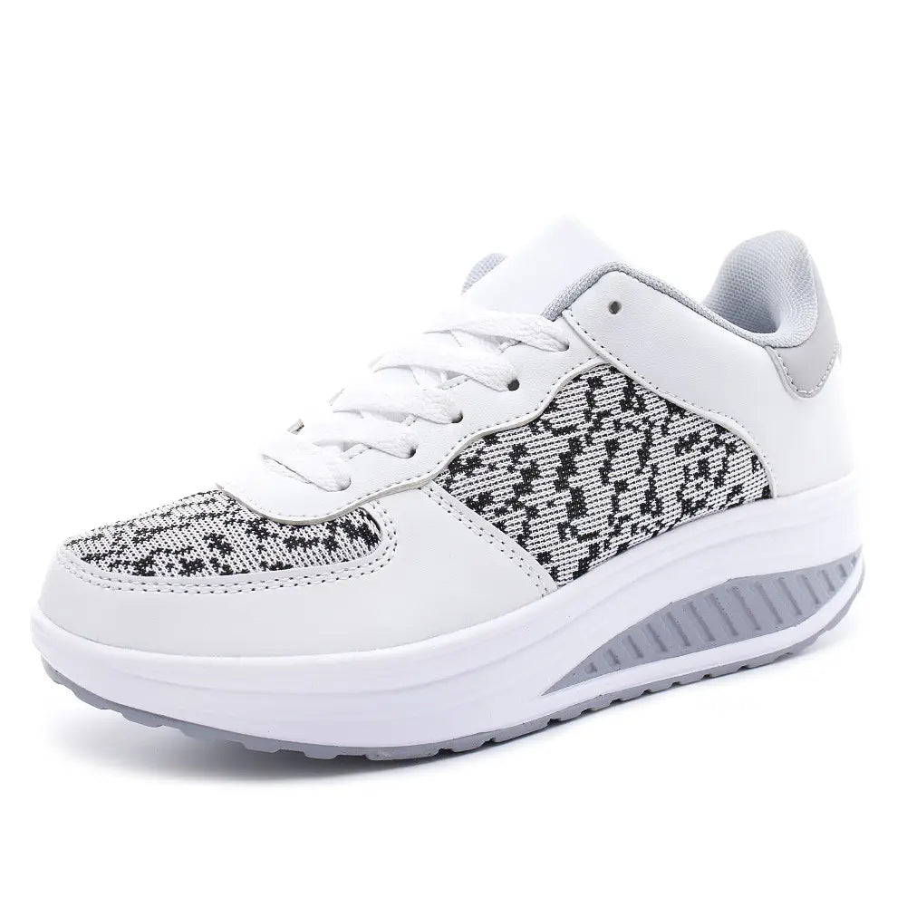 Women’s platform sneakers leather mesh sports shoes featuring white and gray colors with a textured knit pattern on the side panels white laces and a cushioned sole.