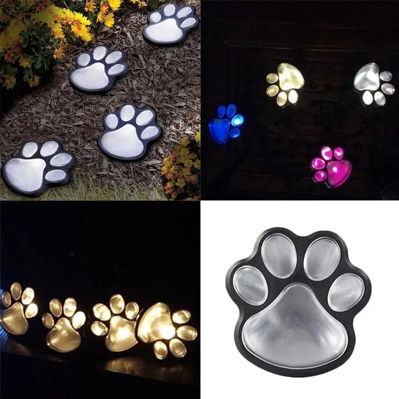 Schwarze und silberne, pfotenförmige Solar-Gartenleuchten mit beleuchteten transluzenten Pads, ausgelegt für die Außendekoration von Gartenwegen mit LED-Beleuchtung.