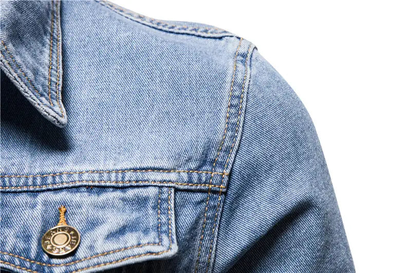 Men light wash slim fit denim jacket featuring gold-toned button and contrasting stitching.