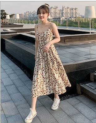 A flowing beige and brown leopard-print midi dress for women featuring thin spaghetti straps.