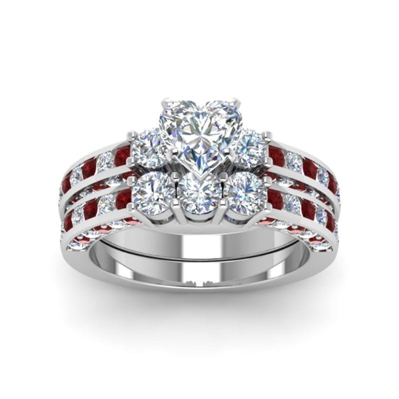 Red wood and zircon inlay couple wedding ring set featuring a sparkling heart-shaped diamond and ruby engagement ring with a sleek silver band and alternating round diamonds and red rubies.