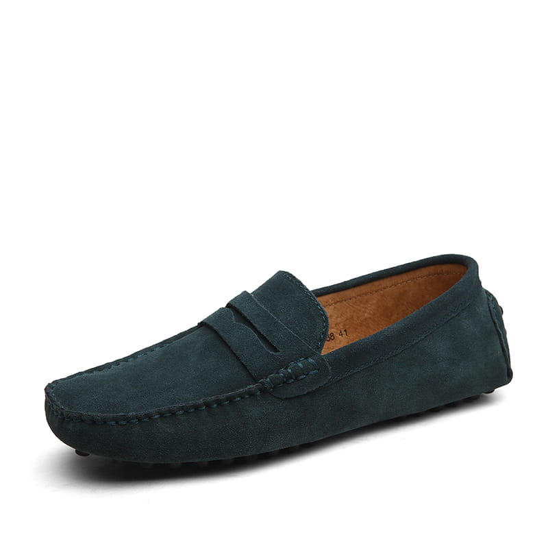Dark green suede loafer with classic moccasin design and tan leather lining for men’s casual wear.