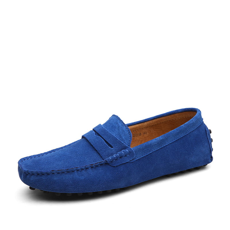 A vibrant royal blue suede leather loafer for men featuring a classic moccasin design and stitched detailing for casual wear.