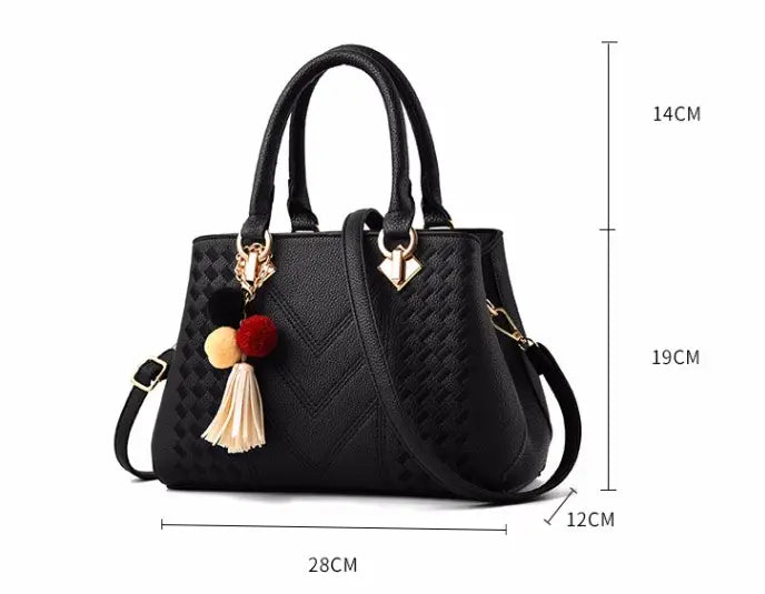black textured woven pu leather crossbody handbag for women with gold-tone hardware and decorative tassel charm