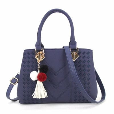 Navy blue woven pu leather crossbody bag with gold-tone hardware and a colorful pom-pom tassel charm for luxury women handbags.